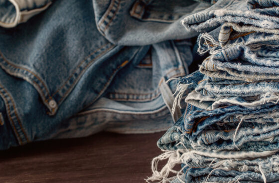 Stack,Of,Old,Blue,Jeans,As,A,Background.denim,Fabric,Closeup.