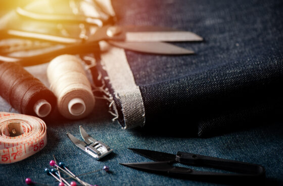 Indigo,Denim,Fabric,With,Sewing,Equipments,,Garment,Industrial,Concept.